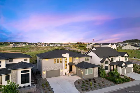 aerial view of a house with a yard