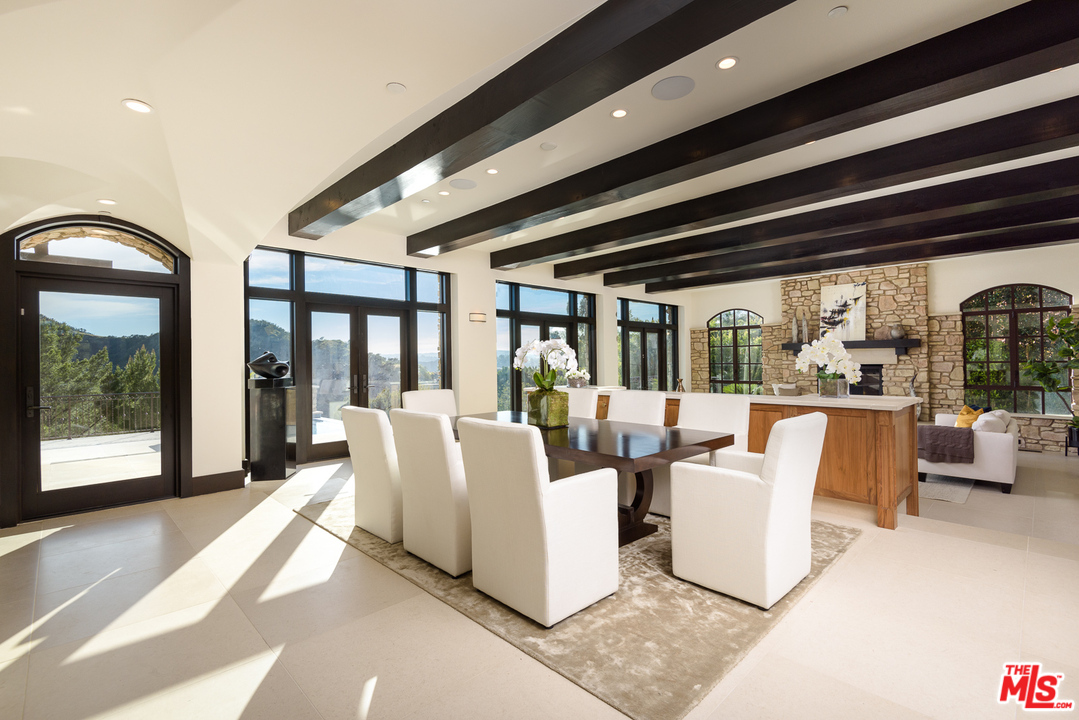 2175 Summitridge Drive Beverly Hills, CA 90210 - Photo 15 of 51 a living room with furniture and large windows
