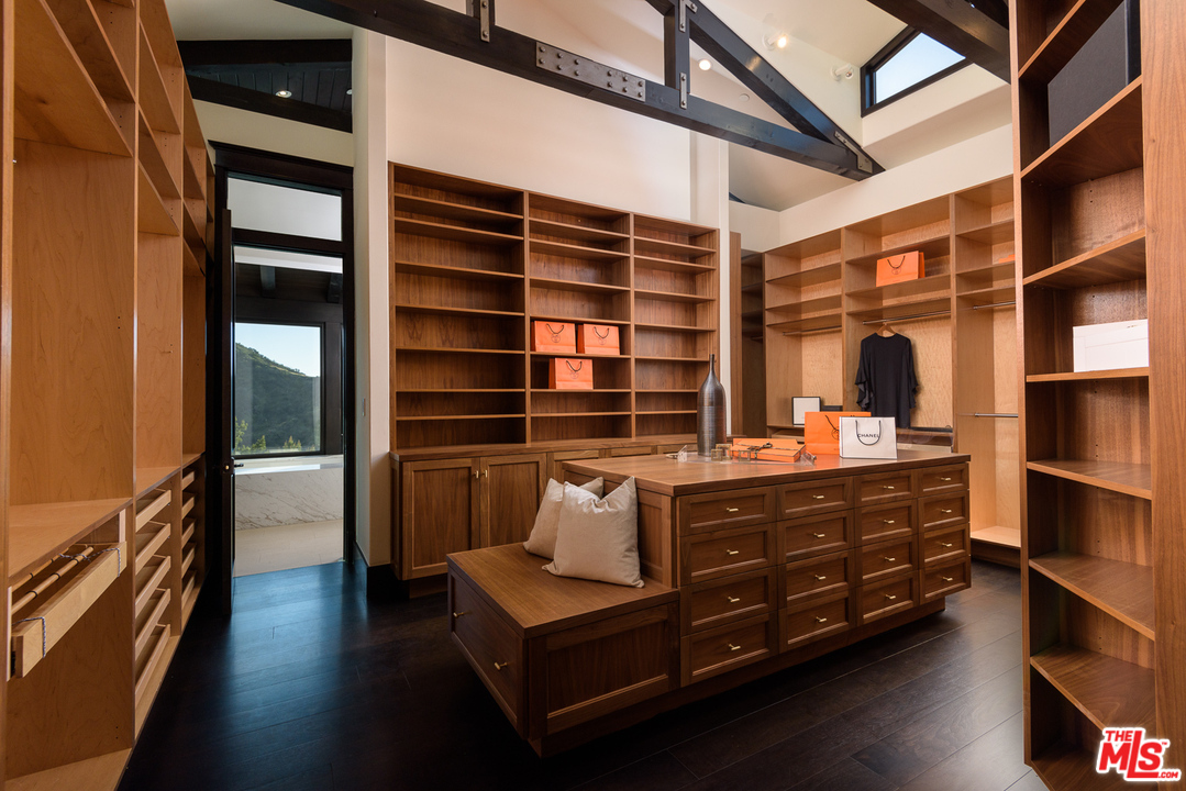 2175 Summitridge Drive Beverly Hills, CA 90210 - Photo 31 of 51 a room with furniture cabinets and window