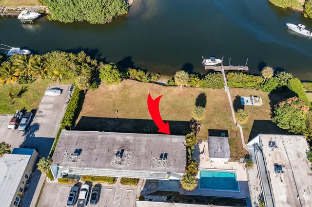 an aerial view of residential house with outdoor space and swimming pool