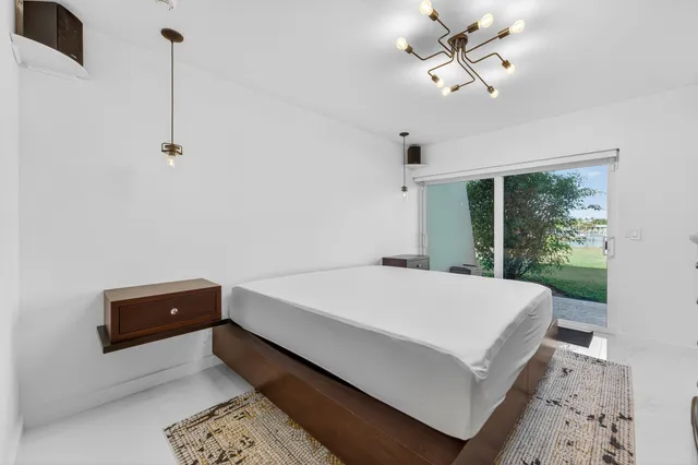 a view of a bathroom with dual sinks