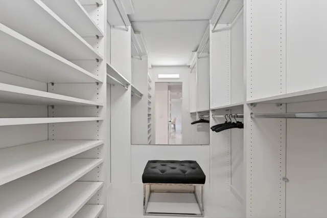 a bathroom with a shower a toilet and a sink