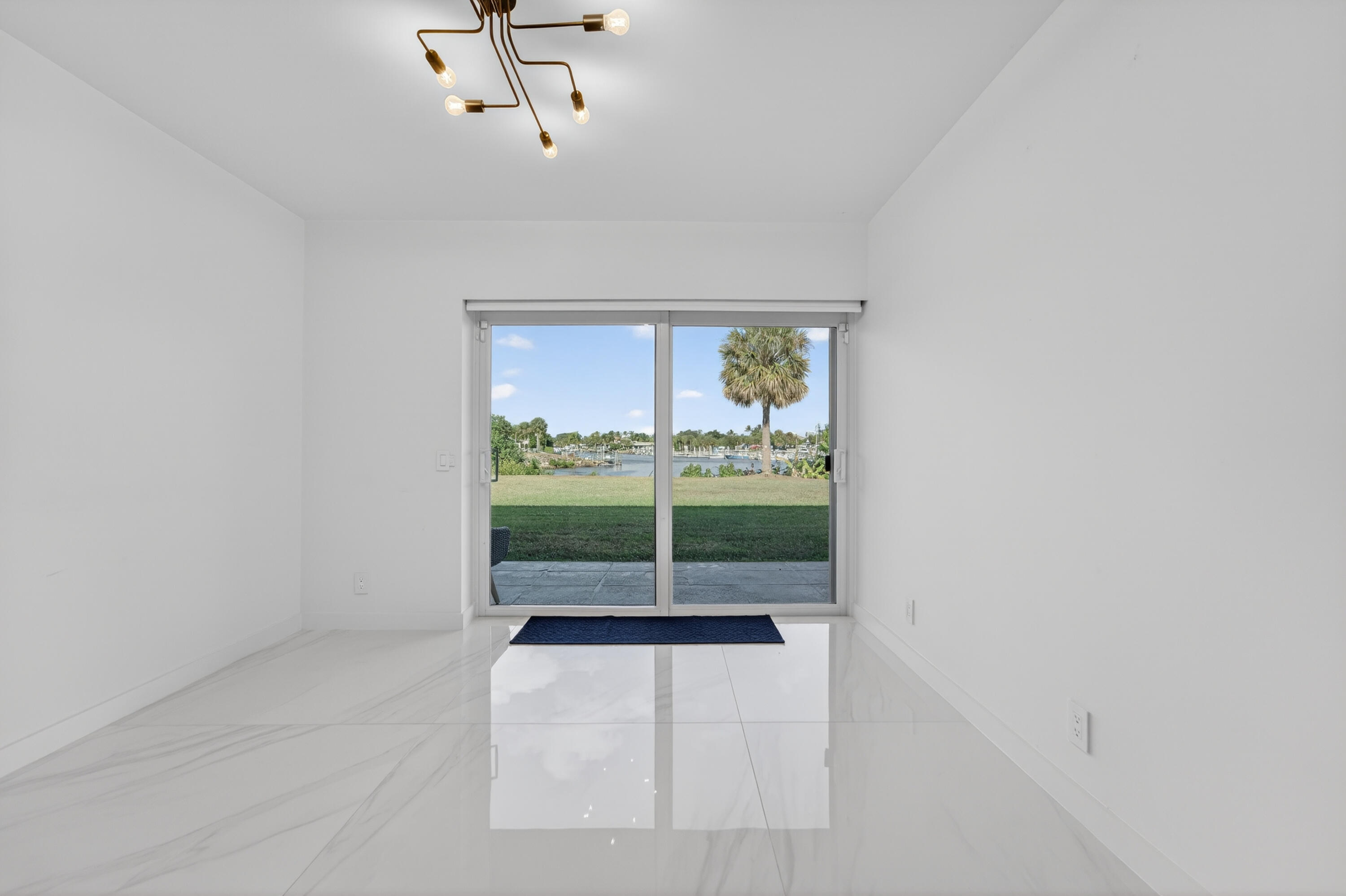 725 Hummingbird Way, Unit 103 North Palm Beach, FL 33408 - Photo 20 of 52 a view of a room with a window