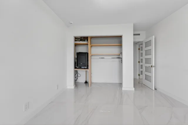 a bathroom with a shower a toilet and a sink