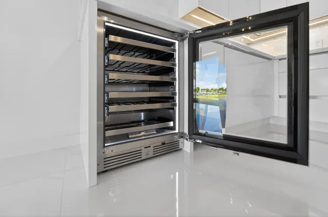 a kitchen with a sink and refrigerator