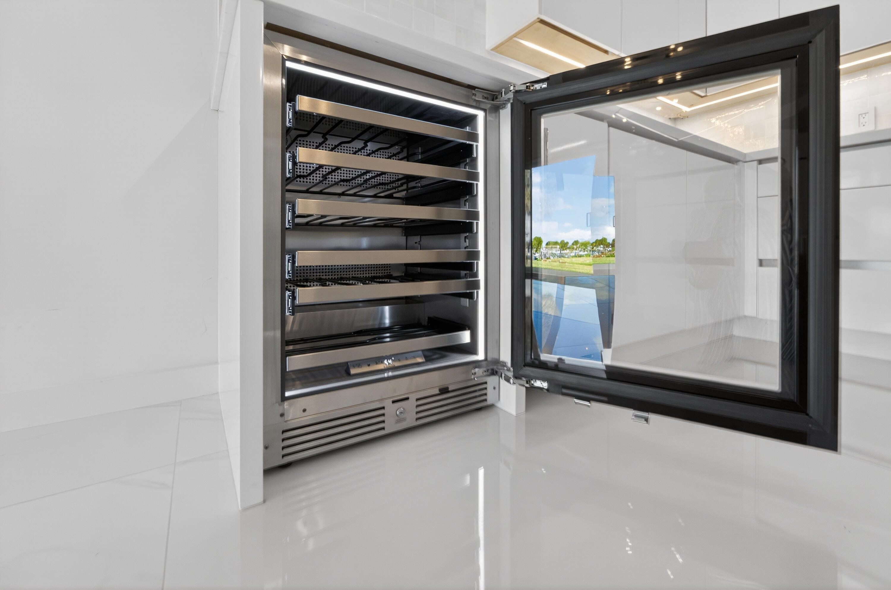 725 Hummingbird Way, Unit 103 North Palm Beach, FL 33408 - Photo 29 of 52 a view of an empty room with a fireplace