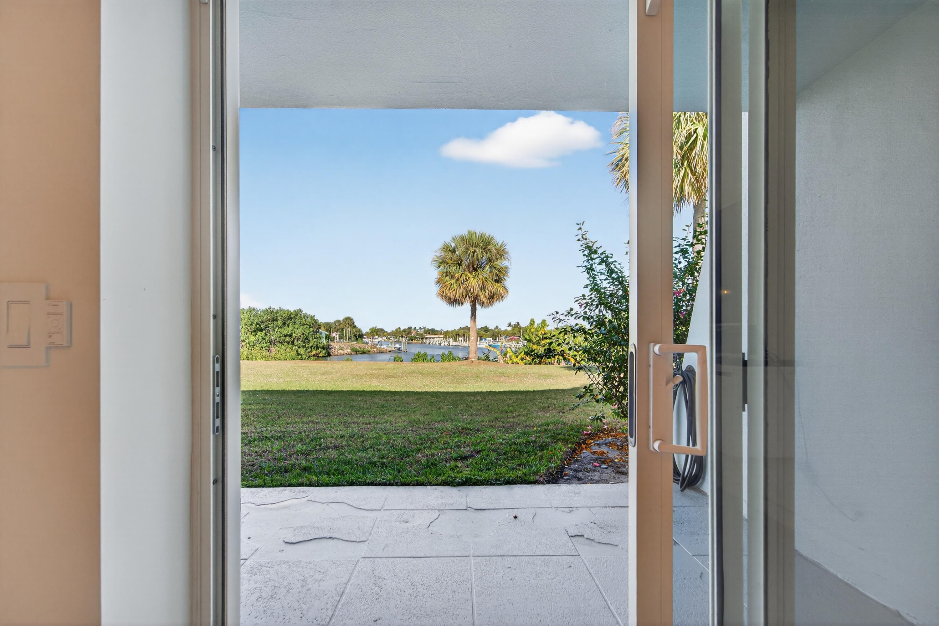 725 Hummingbird Way, Unit 103 North Palm Beach, FL 33408 - Photo 35 of 52 a view of a window in a yard