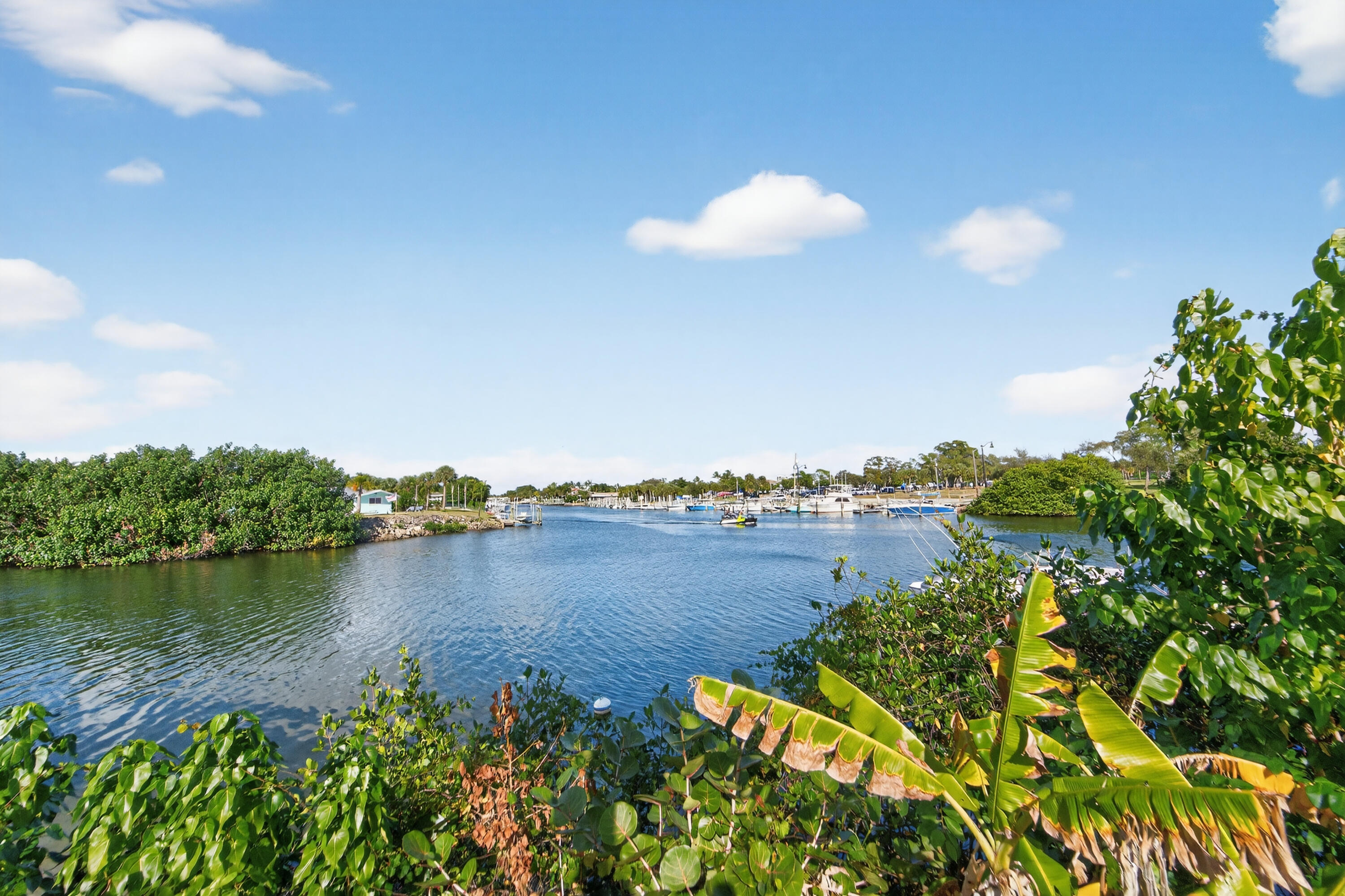 725 Hummingbird Way, Unit 103 North Palm Beach, FL 33408 - Photo 43 of 52 a view of a lake with a city