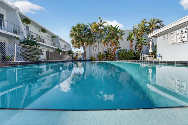 an aerial view of a house with a lake view