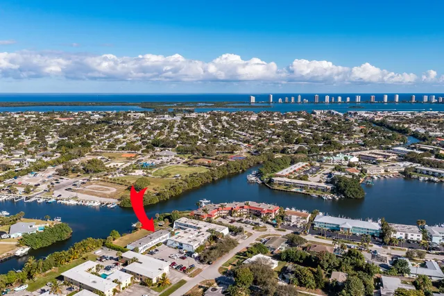 a view of a patio with a table and chairs