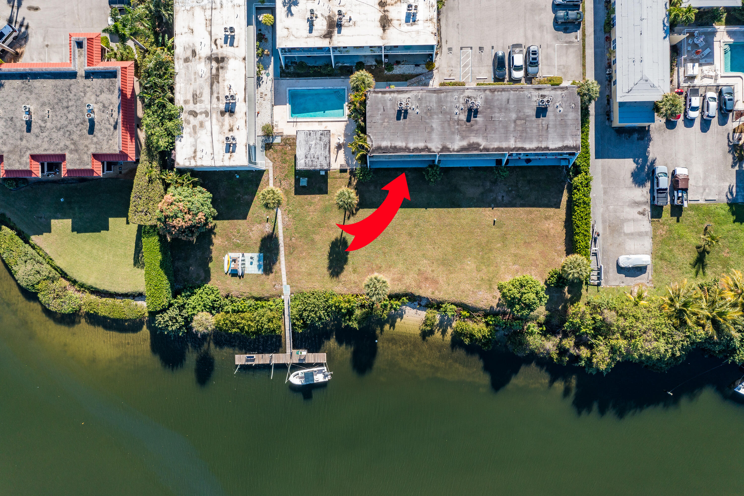 725 Hummingbird Way, Unit 103 North Palm Beach, FL 33408 - Photo 49 of 52 an aerial view of a house with swimming pool and outdoor seating
