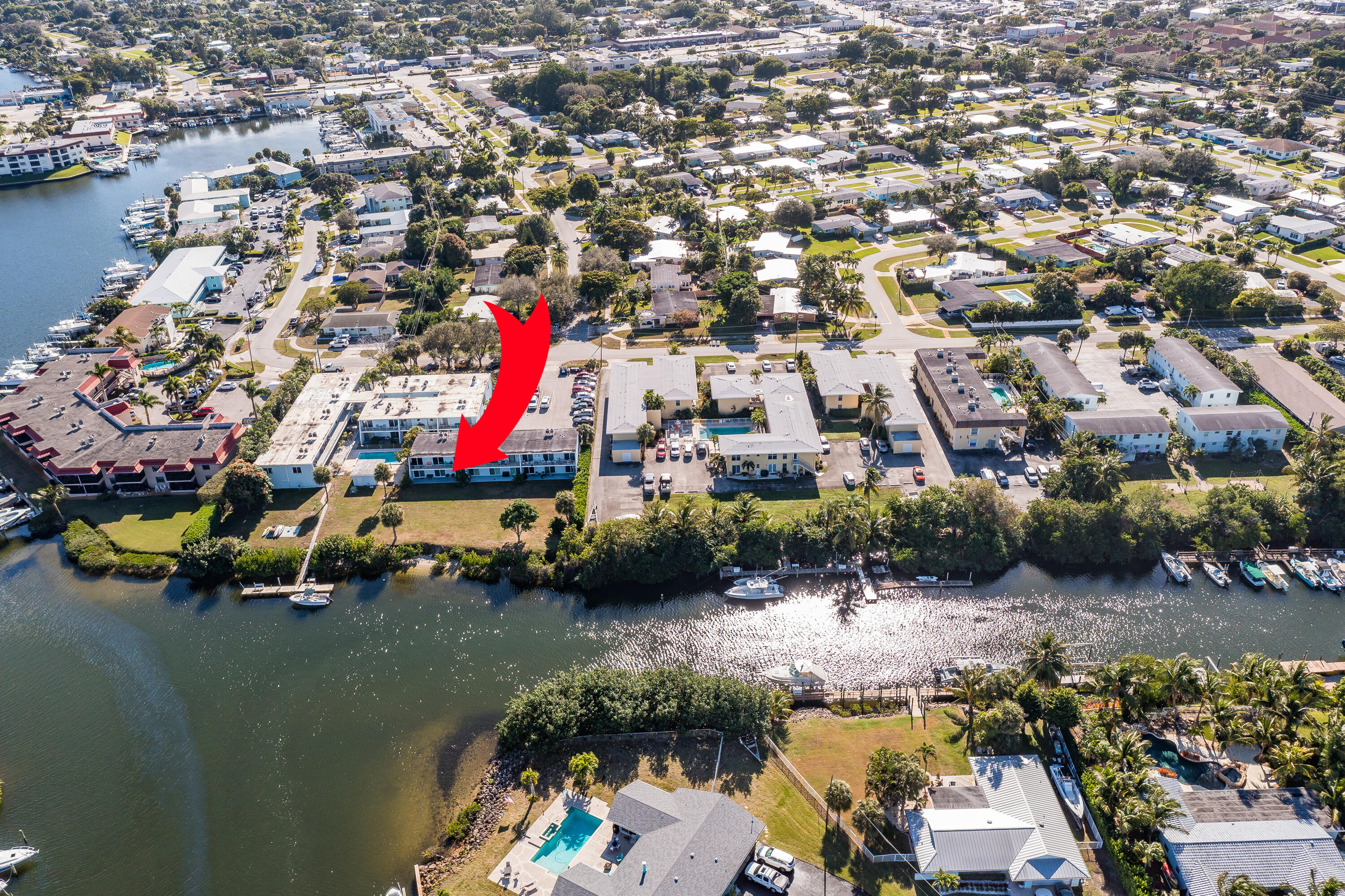 725 Hummingbird Way, Unit 103 North Palm Beach, FL 33408 - Photo 50 of 52 an aerial view of a house with a lake view