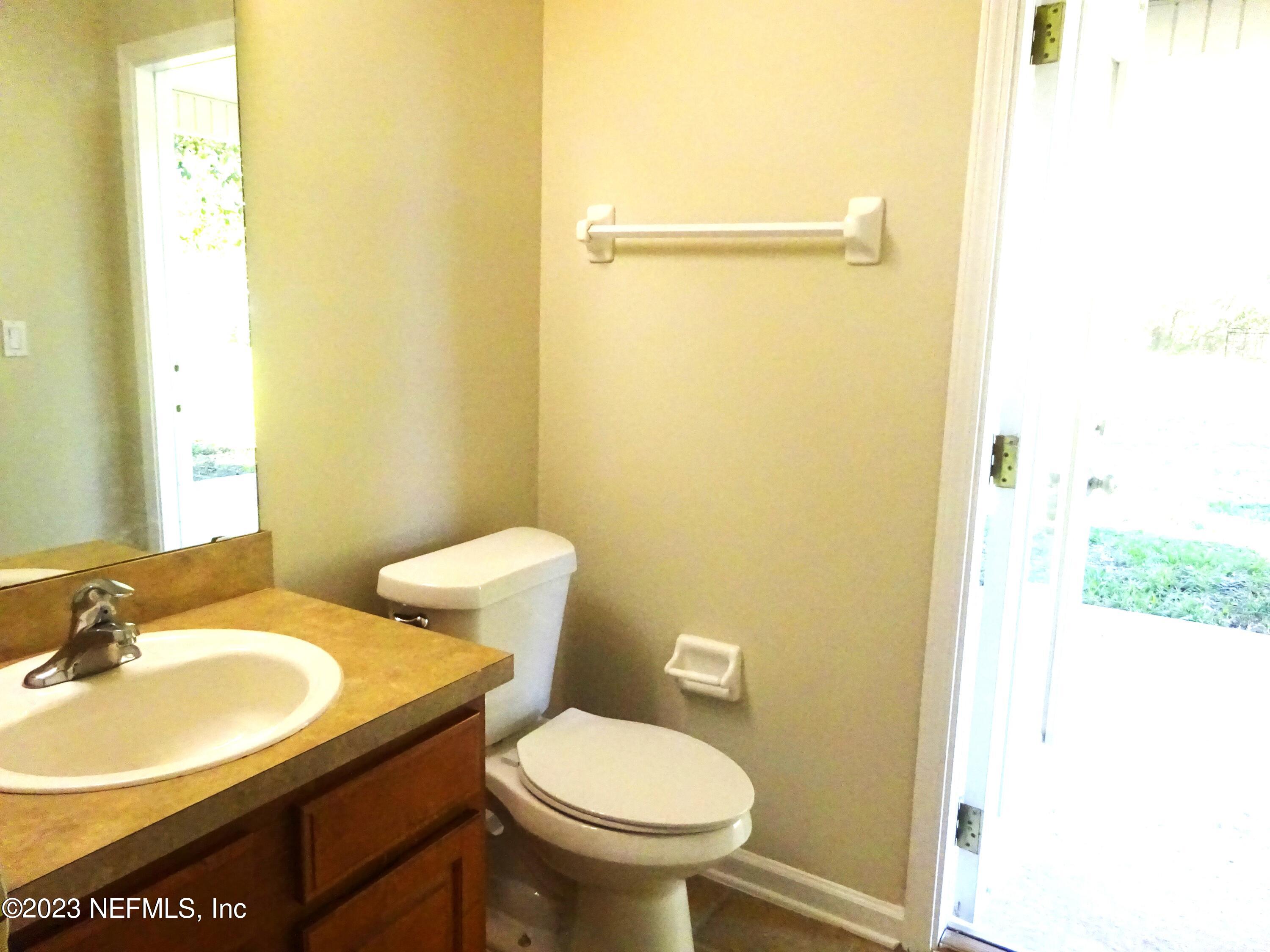731 East Red House Branch Road St. Augustine, FL 32084 - Photo 12 of 54 a bathroom with a sink and a toilet