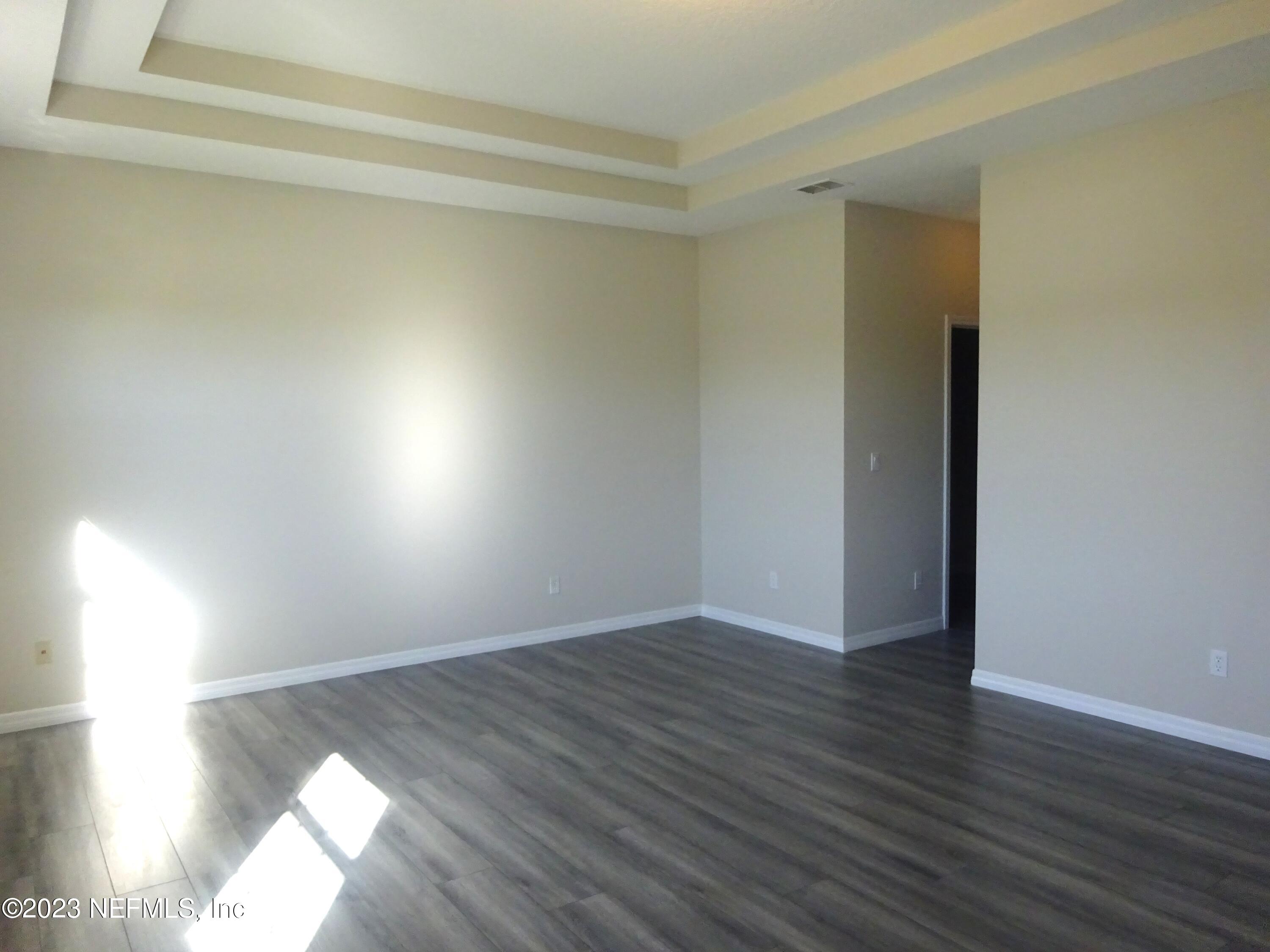 731 East Red House Branch Road St. Augustine, FL 32084 - Photo 18 of 54 a view of an empty room and wooden floor