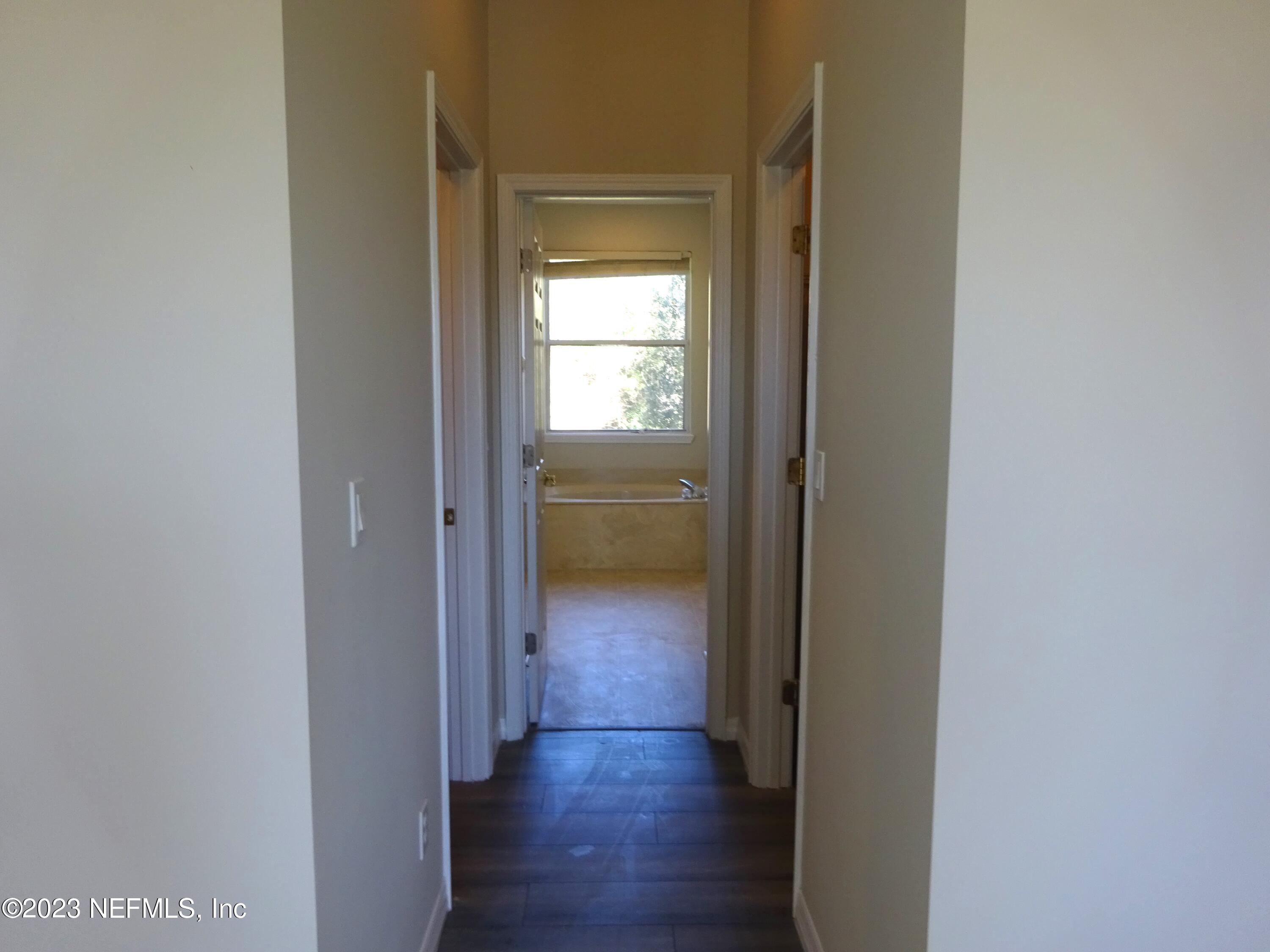 731 East Red House Branch Road St. Augustine, FL 32084 - Photo 19 of 54 a view of a hallway with wooden floor