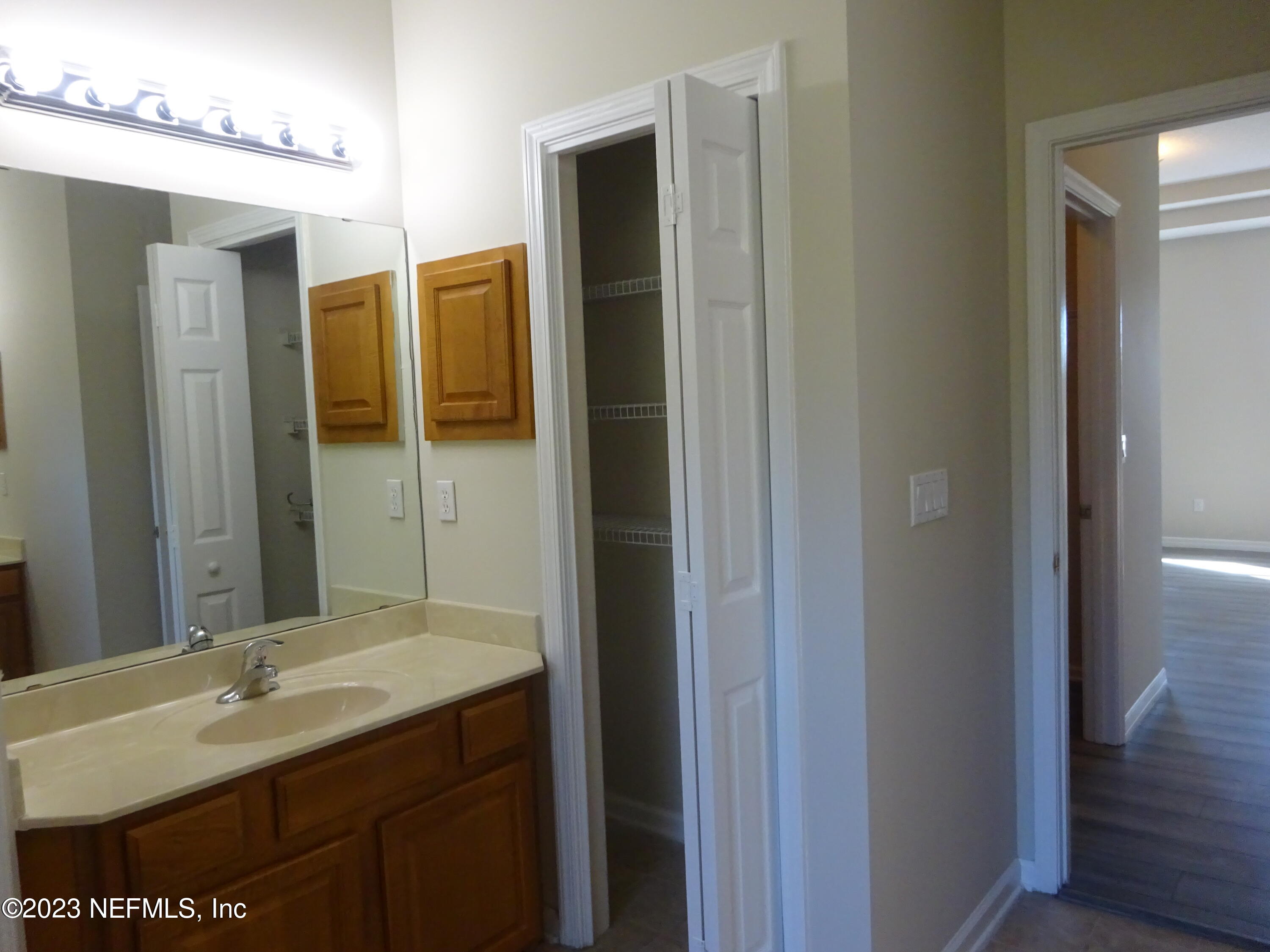 731 East Red House Branch Road St. Augustine, FL 32084 - Photo 22 of 54 a bathroom with a sink and a mirror