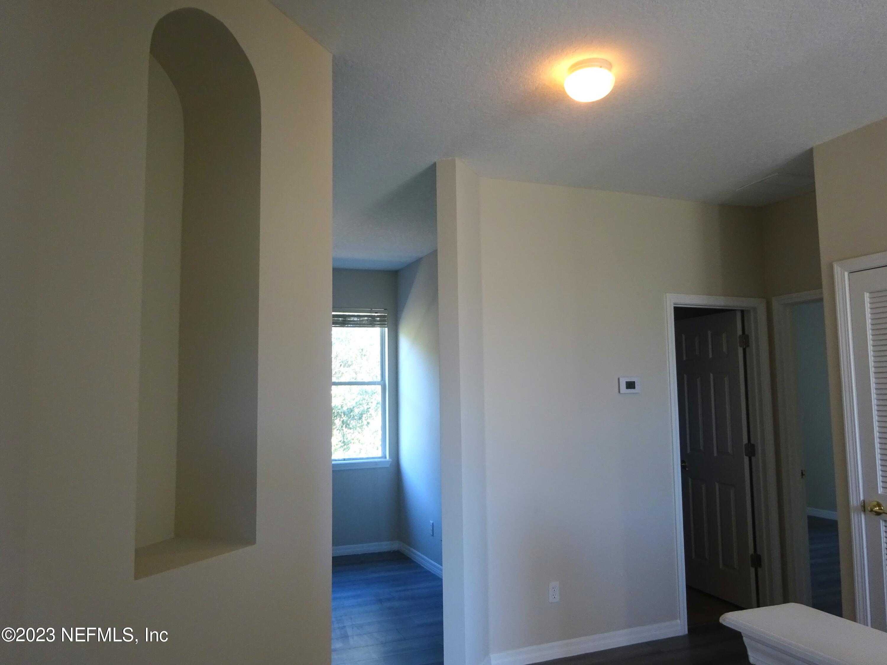 731 East Red House Branch Road St. Augustine, FL 32084 - Photo 23 of 54 a view of a hallway with wooden floor