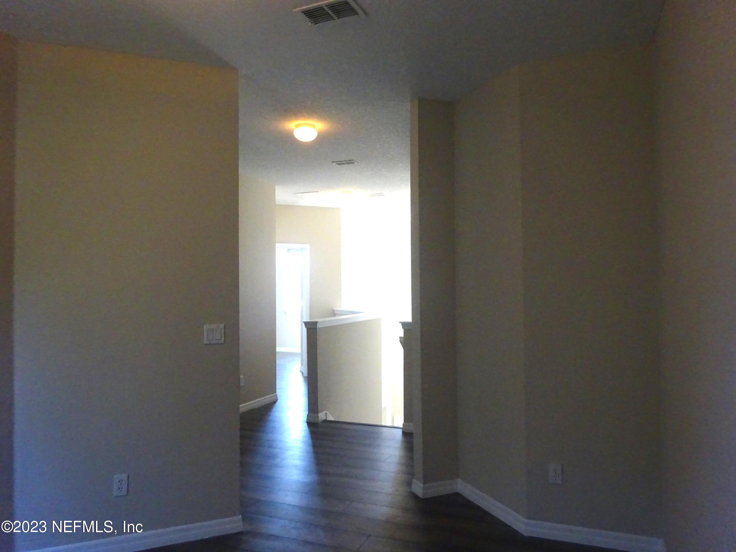731 East Red House Branch Road St. Augustine, FL 32084 - Photo 25 of 54 a view of a hallway with wooden floor