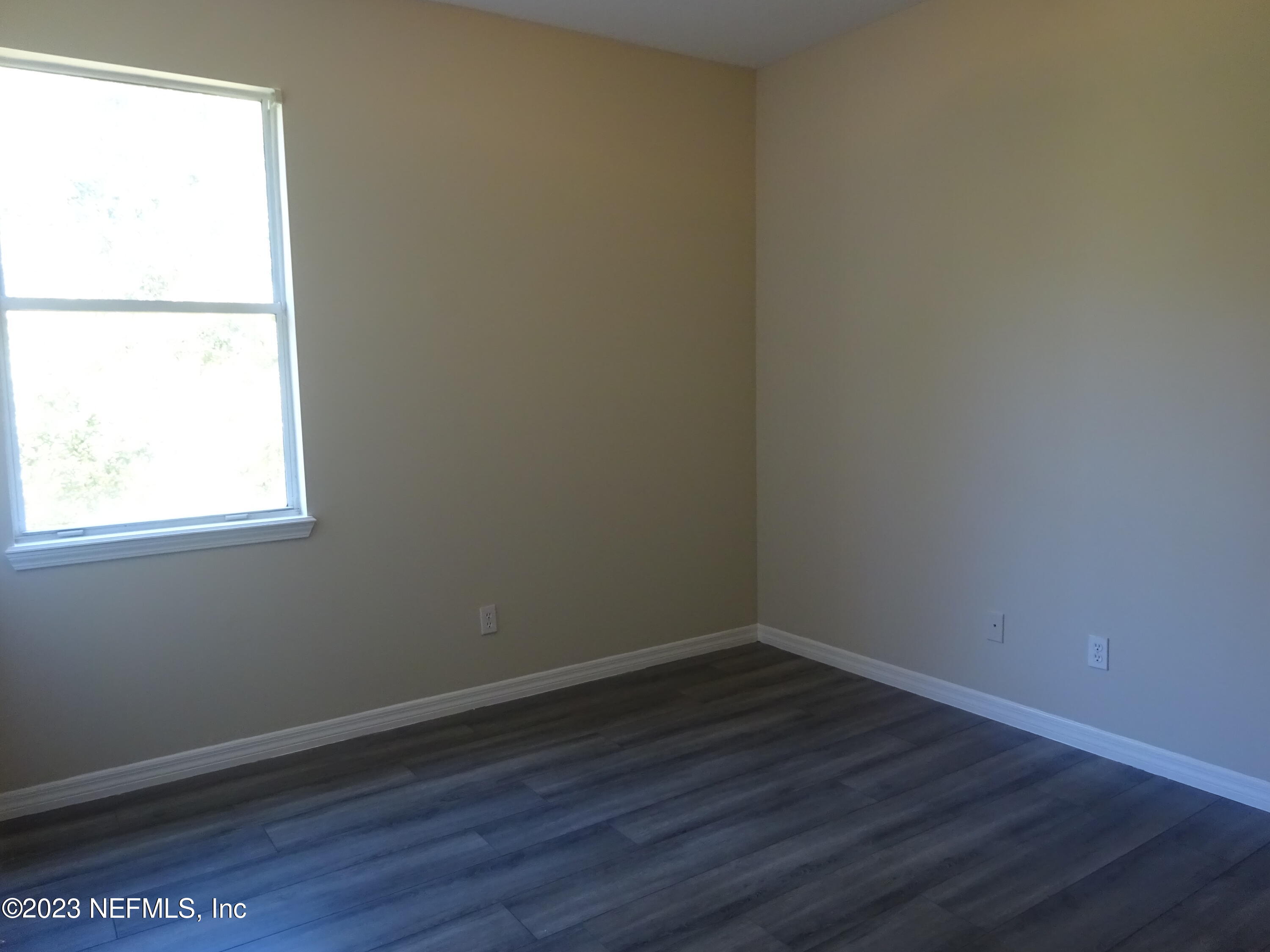 731 East Red House Branch Road St. Augustine, FL 32084 - Photo 28 of 54 a view of a small space with wooden floor and a window