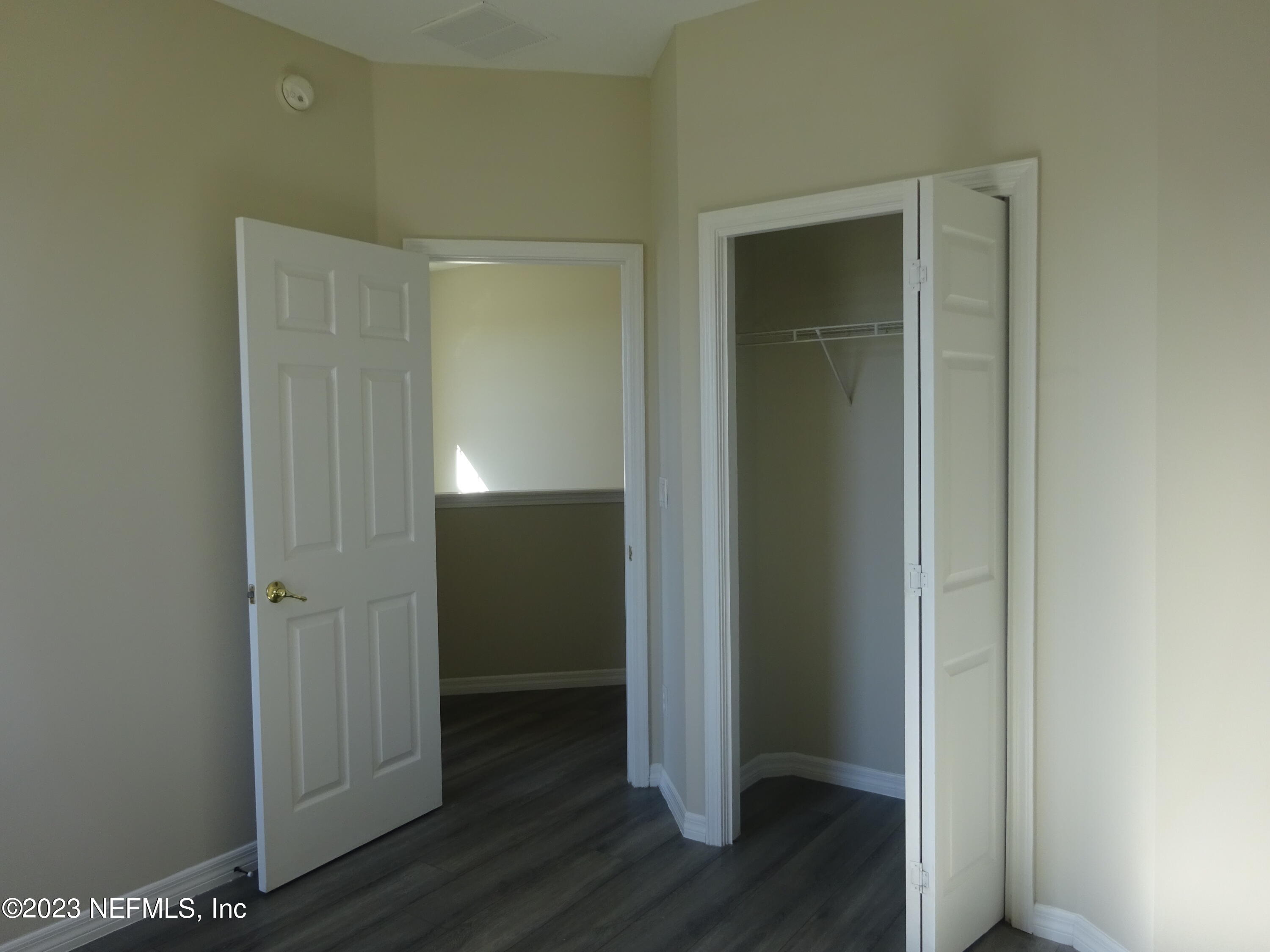 731 East Red House Branch Road St. Augustine, FL 32084 - Photo 31 of 54 an empty room with wooden floor & closet