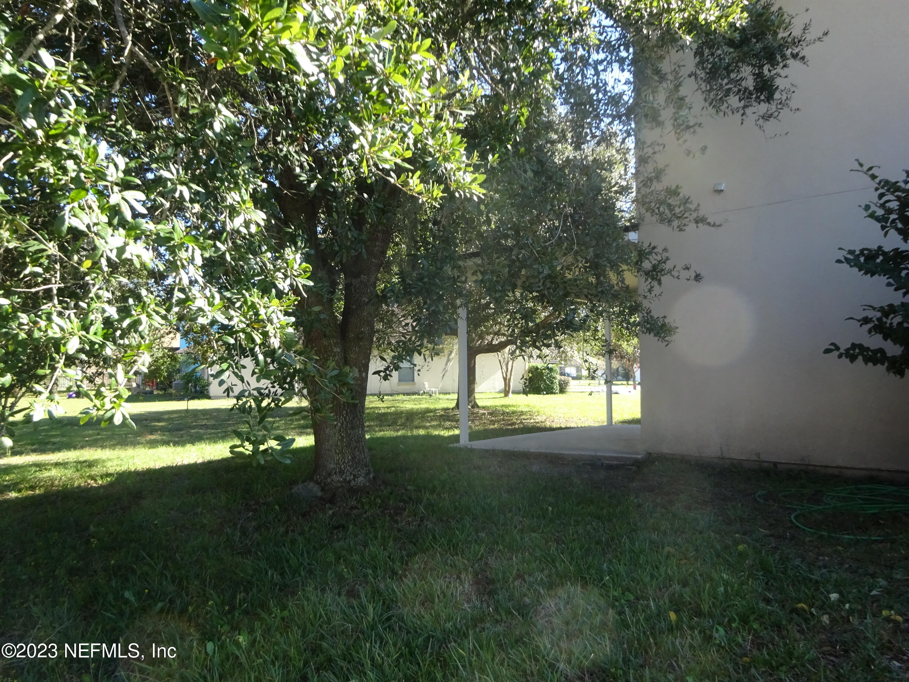 731 East Red House Branch Road St. Augustine, FL 32084 - Photo 36 of 54 a view of yard with green space and trees around