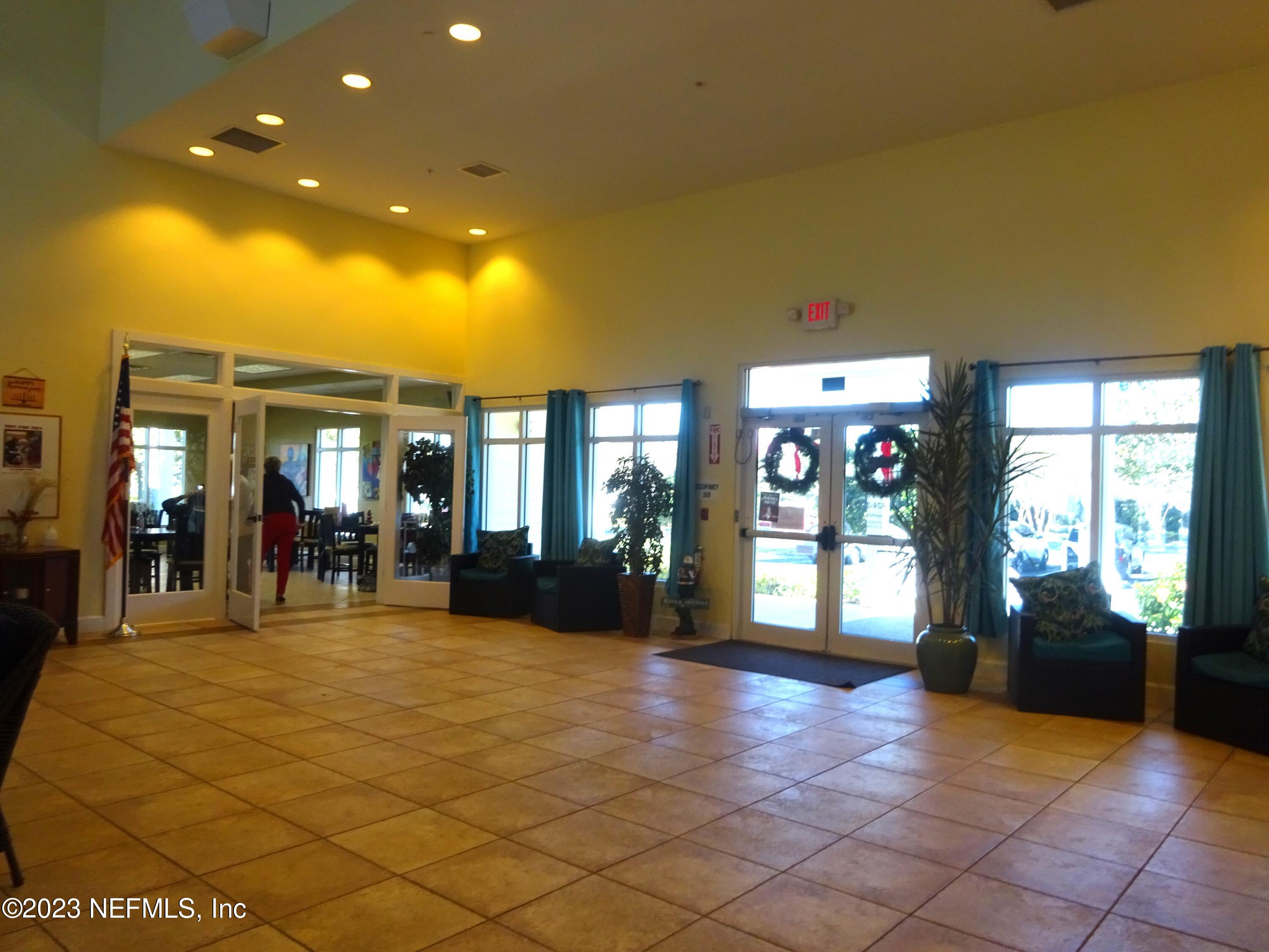 731 East Red House Branch Road St. Augustine, FL 32084 - Photo 48 of 54 a view of a lobby with black carpet