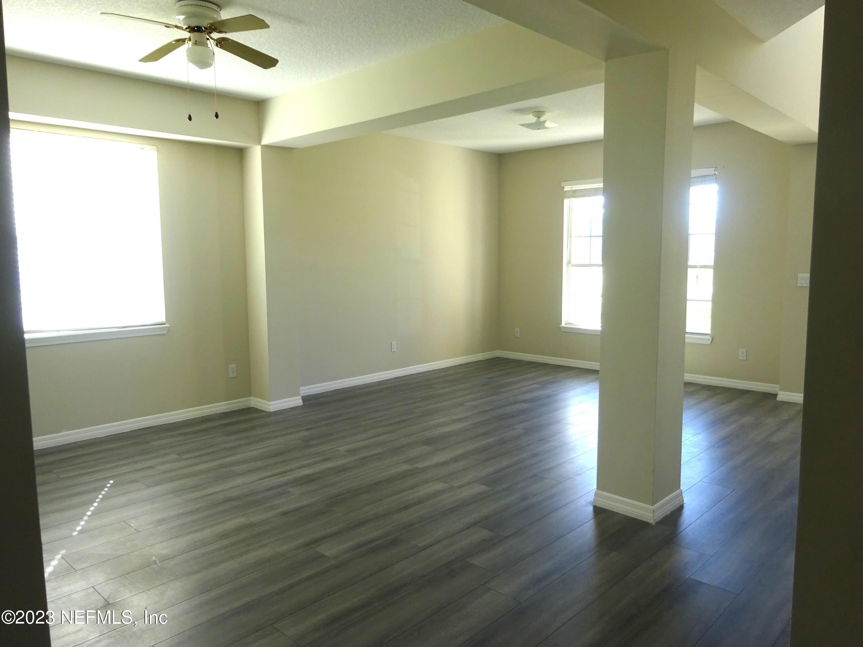 731 East Red House Branch Road St. Augustine, FL 32084 - Photo 6 of 54 a view of livingroom with hardwood floor and window