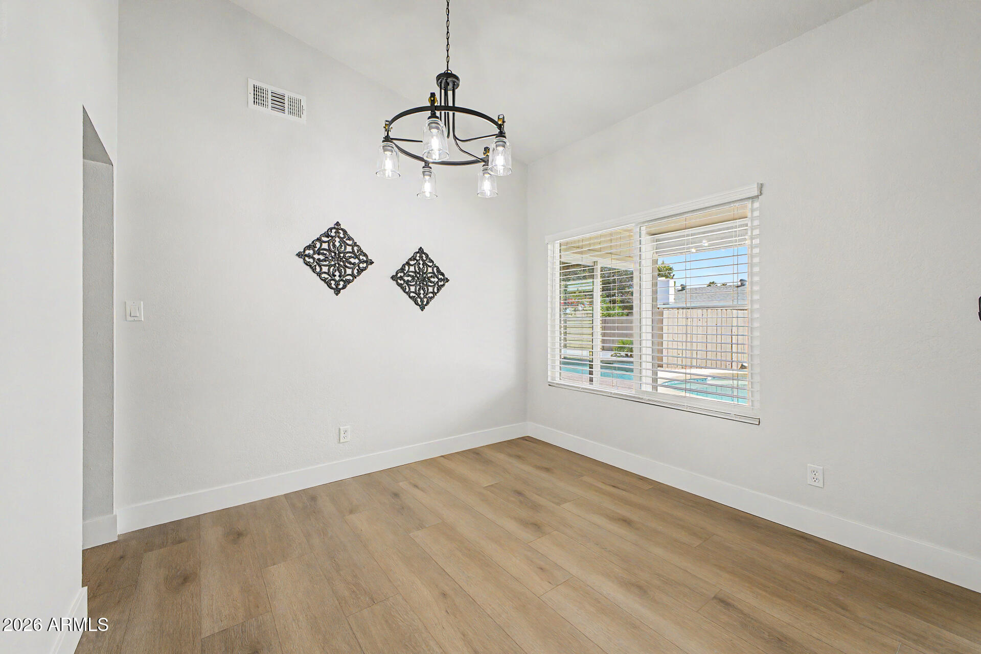 1009 West Pampa Avenue Mesa, AZ 85210 - Photo 14 of 31 an empty room with windows