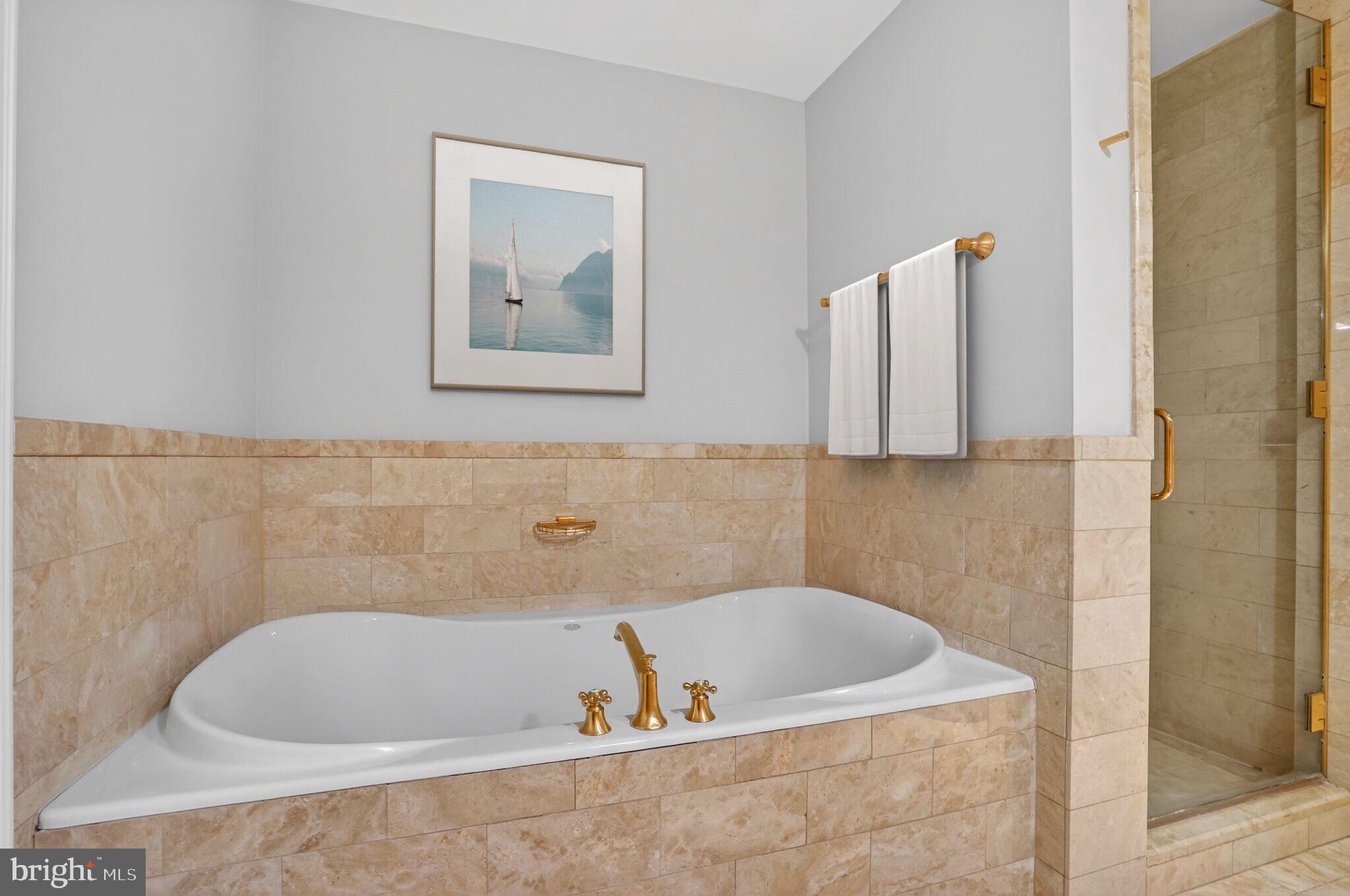 1111 23rd Street Northwest, Unit 2B Washington, DC 20037 - Photo 12 of 22 a bathroom with bathtub and shower