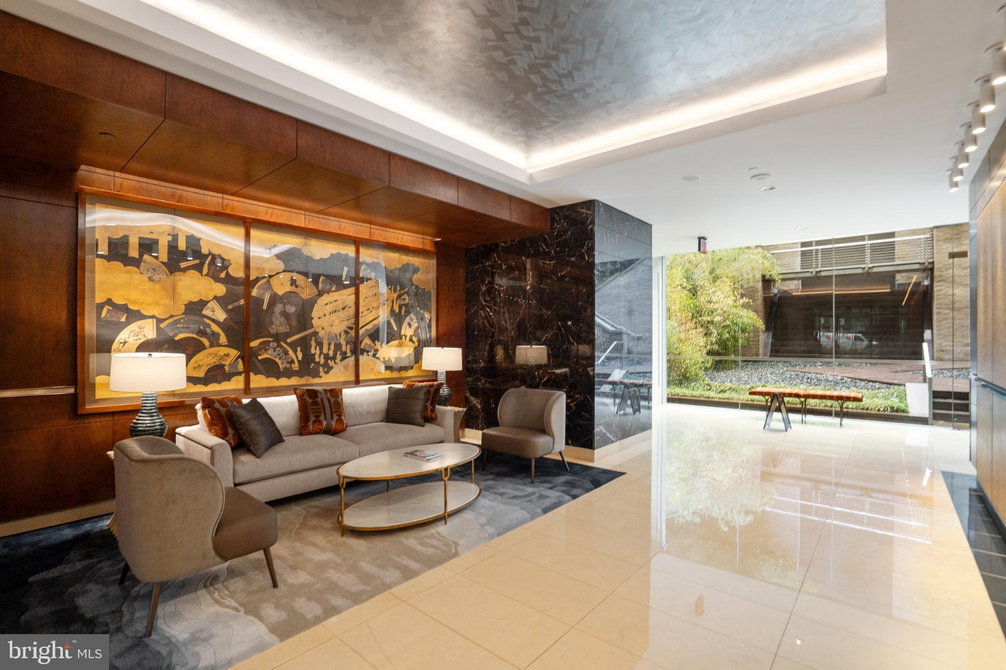 1111 23rd Street Northwest, Unit 2B Washington, DC 20037 - Photo 18 of 22 a living room with furniture and a large window
