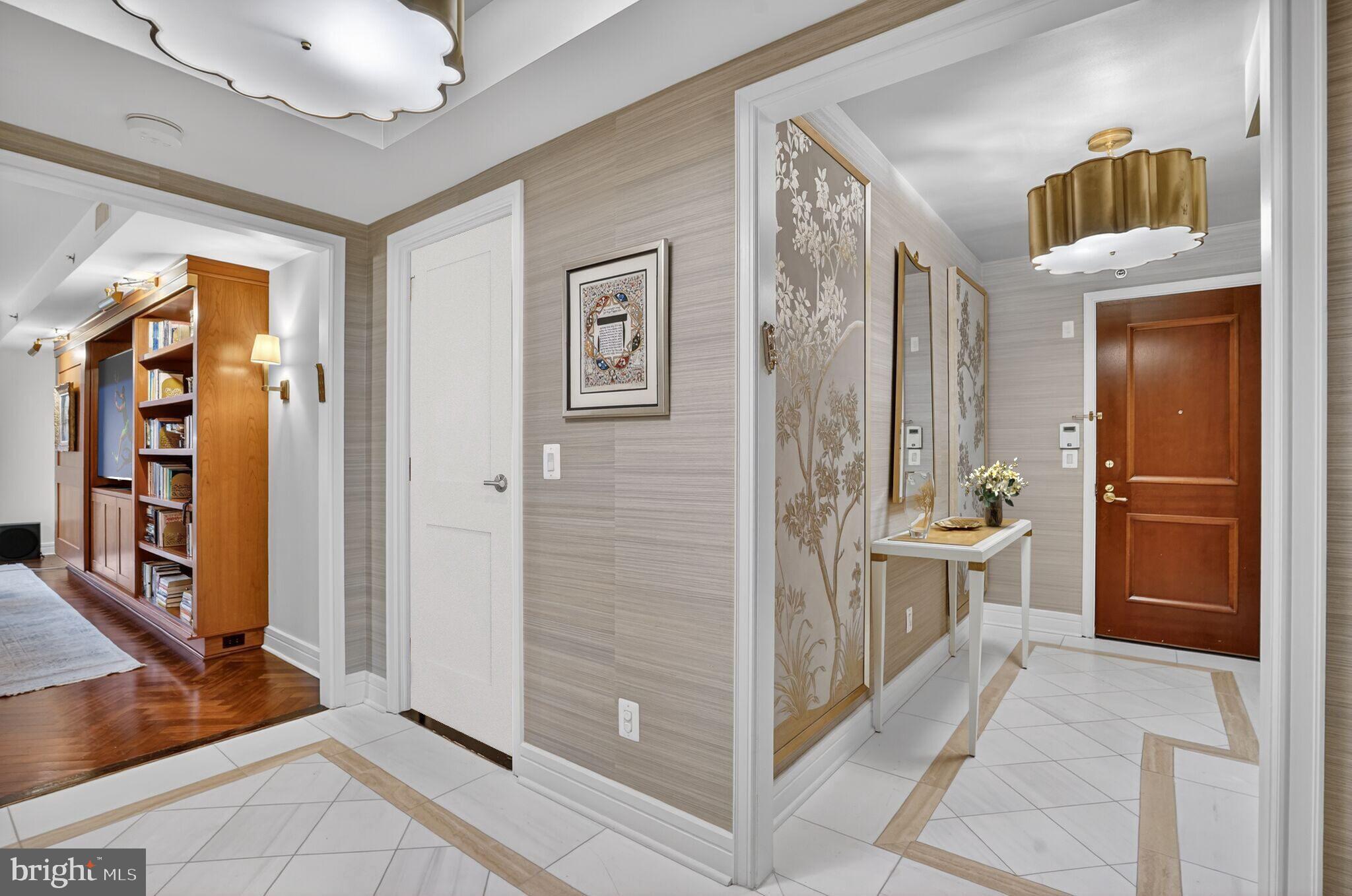 1111 23rd Street Northwest, Unit 2B Washington, DC 20037 - Photo 2 of 22 a bathroom with a glass door shower a mirror and a sink