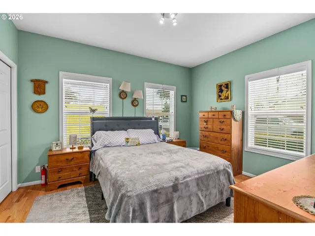 a bedroom with a bed and a dresser