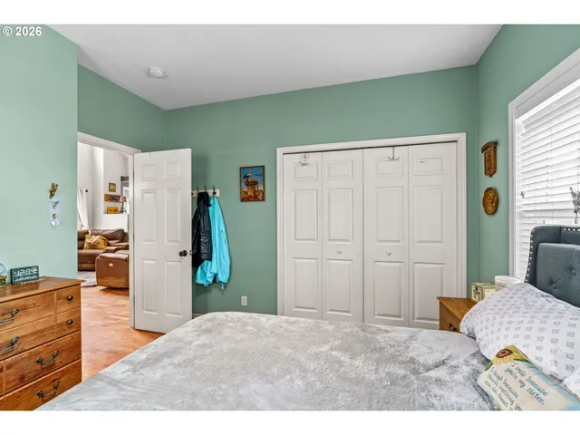 a bedroom with a bed and a dresser