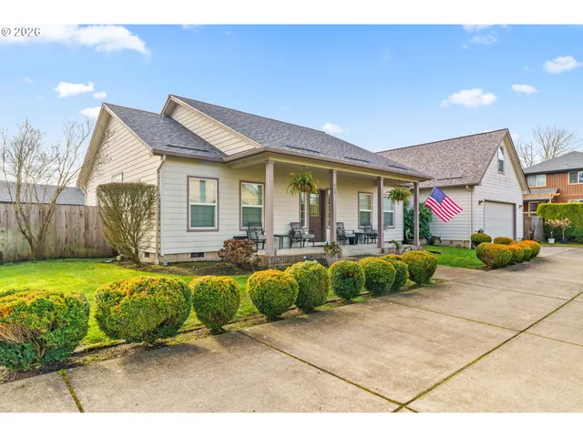 a front view of house with yard and outdoor seating