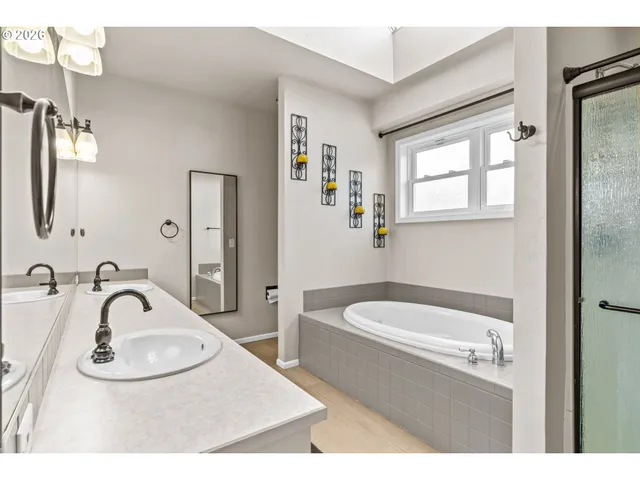 a bathroom with a sink a toilet and a bathtub