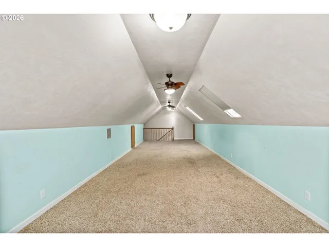 a view of a big room with windows