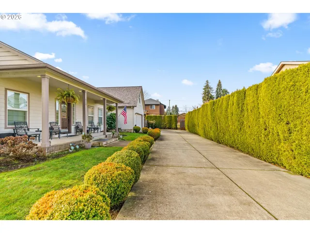 a swimming pool with outdoor seating and yard