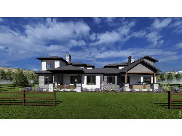 a black and white house with a big yard