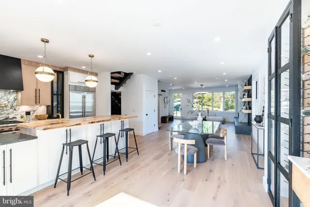 a bathroom with a sink a toilet a tub and shower
