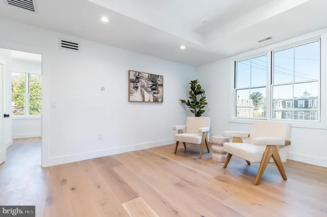 a bathroom with double sink and a mirror