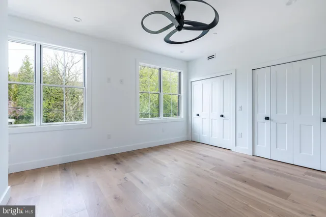 a swimming pool with outdoor seating and city view