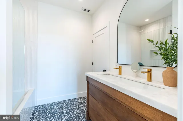 a view of front of house with a deck