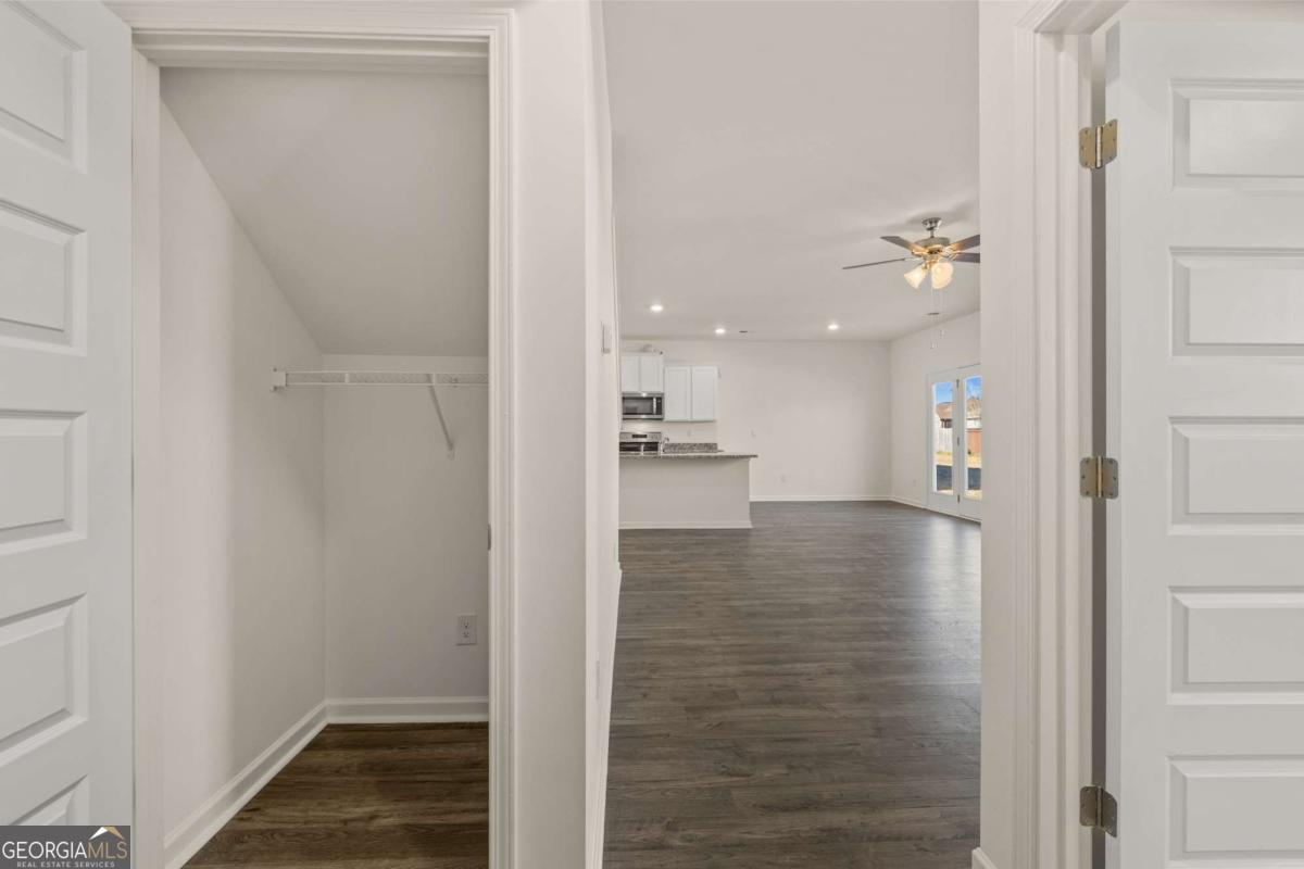 209 Cattle Drive Perry, GA 31069 - Photo 27 of 47 a view of a hallway with wooden floor