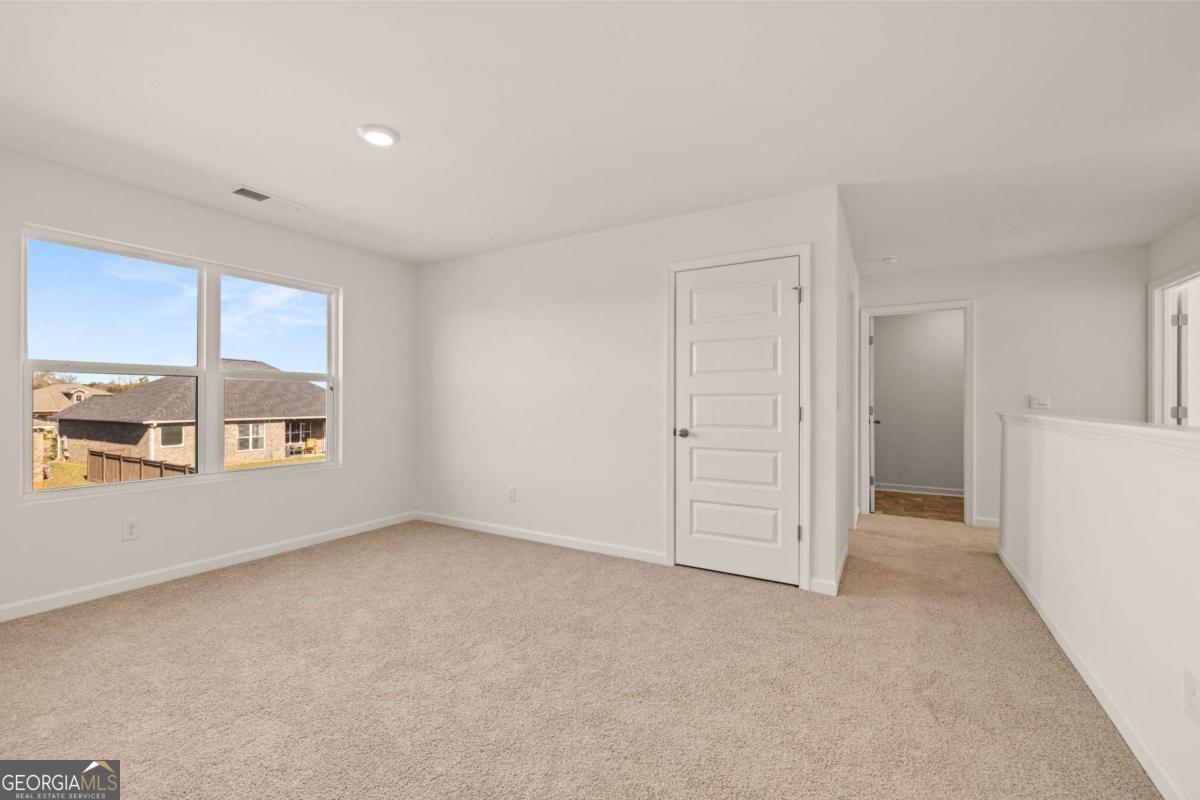 209 Cattle Drive Perry, GA 31069 - Photo 34 of 47 an empty room with a empty space and windows