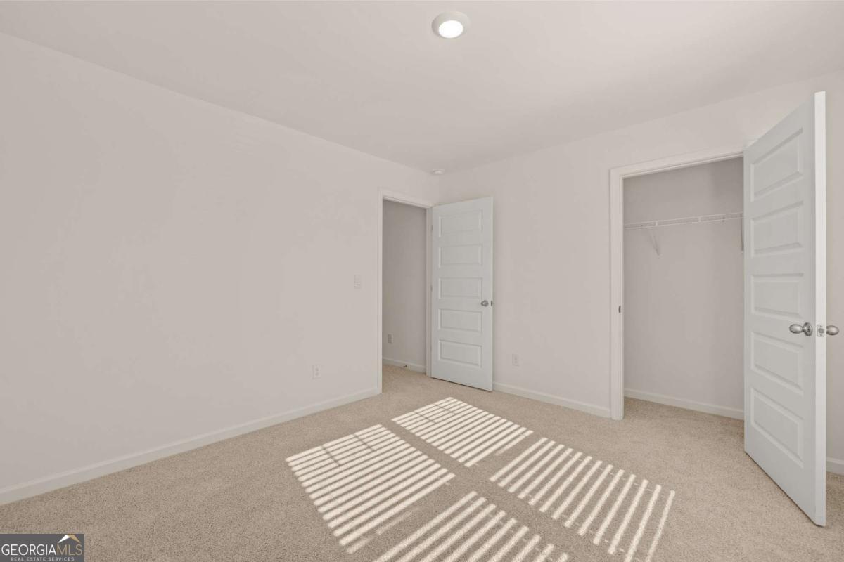 209 Cattle Drive Perry, GA 31069 - Photo 37 of 47 a view of a room with wooden floor and closet