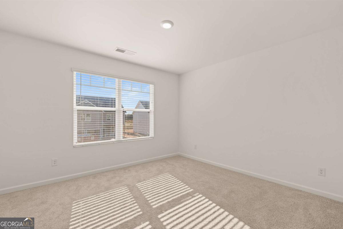 209 Cattle Drive Perry, GA 31069 - Photo 38 of 47 a view of an empty room with a window