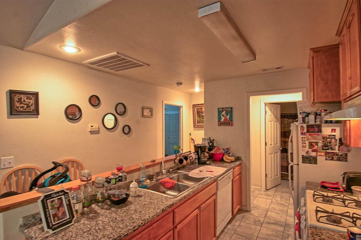 170 Gilmore Road Red Bluff, CA 96080 - Photo 12 of 33 a kitchen with cabinets a stove and a table