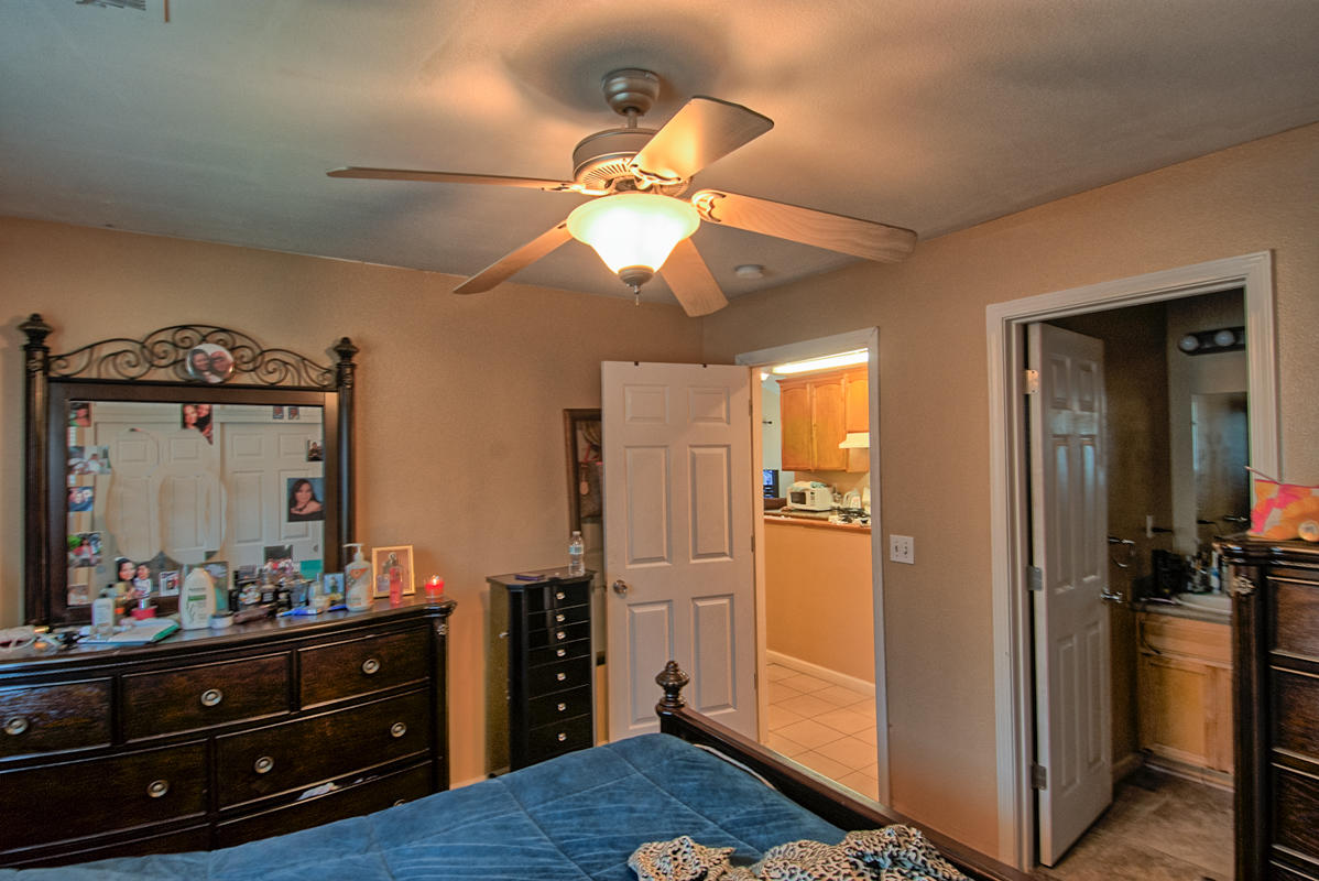 170 Gilmore Road Red Bluff, CA 96080 - Photo 15 of 33 a bedroom with a bed and a mirror on the dresser