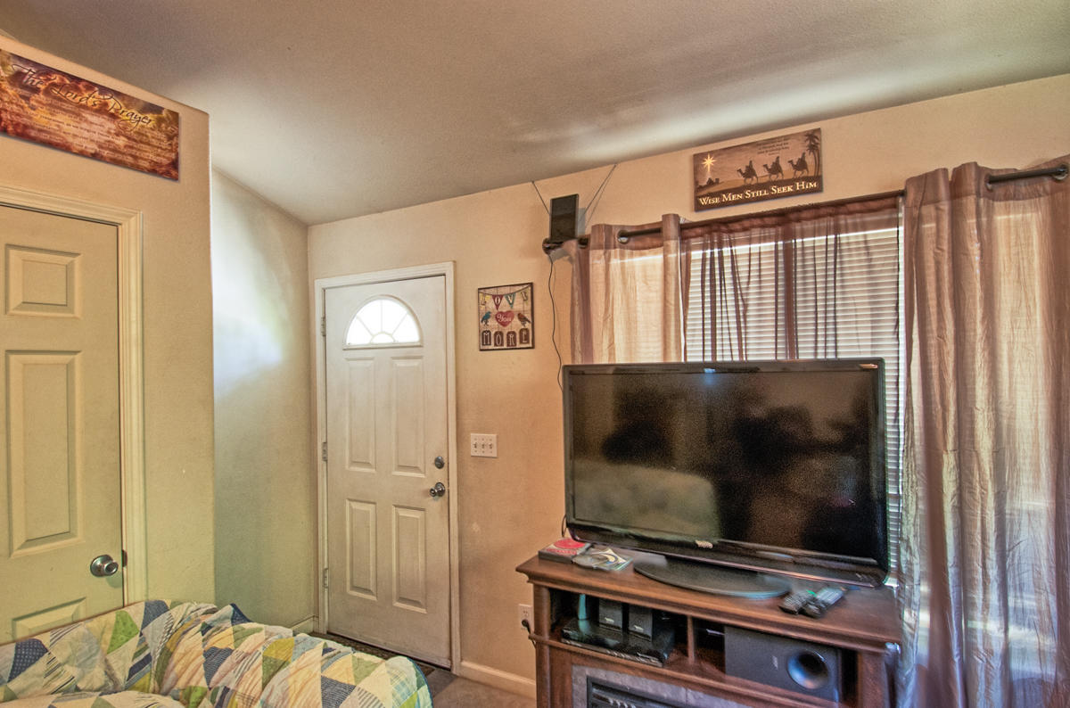 170 Gilmore Road Red Bluff, CA 96080 - Photo 19 of 33 a living room with furniture and a flat screen tv