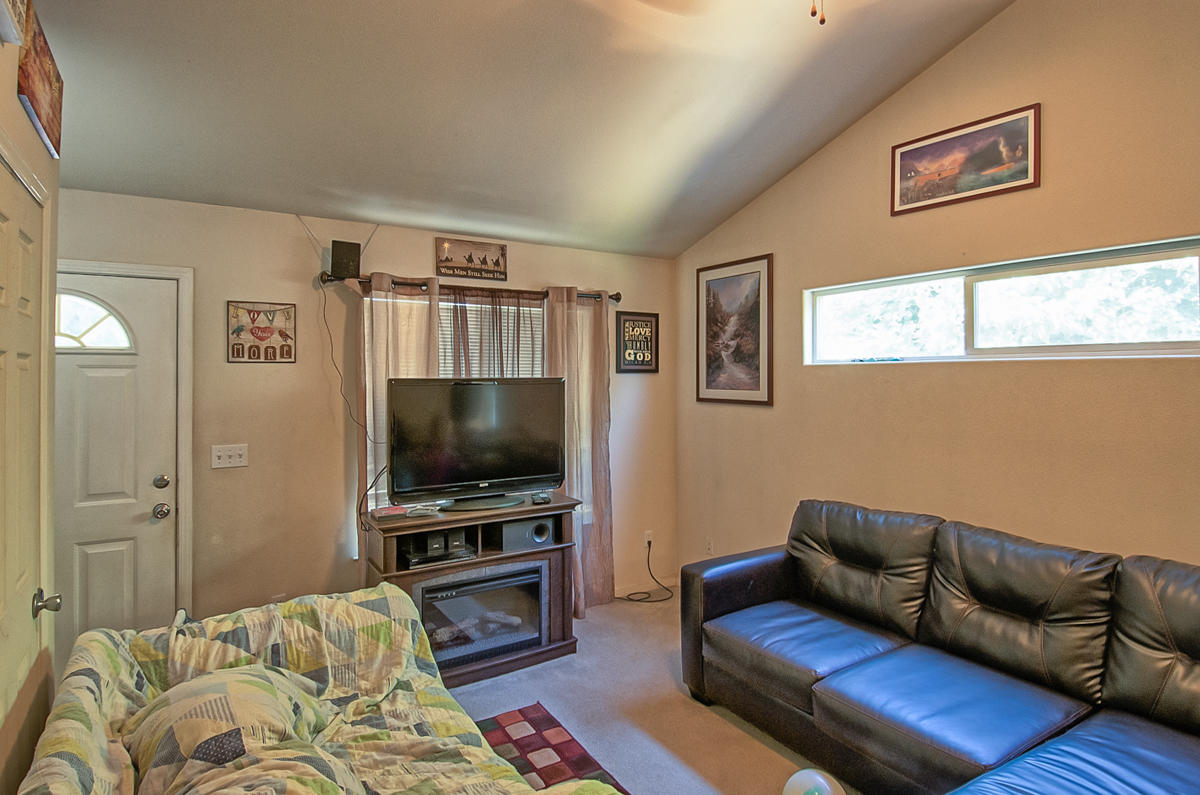 170 Gilmore Road Red Bluff, CA 96080 - Photo 21 of 33 a living room with furniture and a flat screen tv